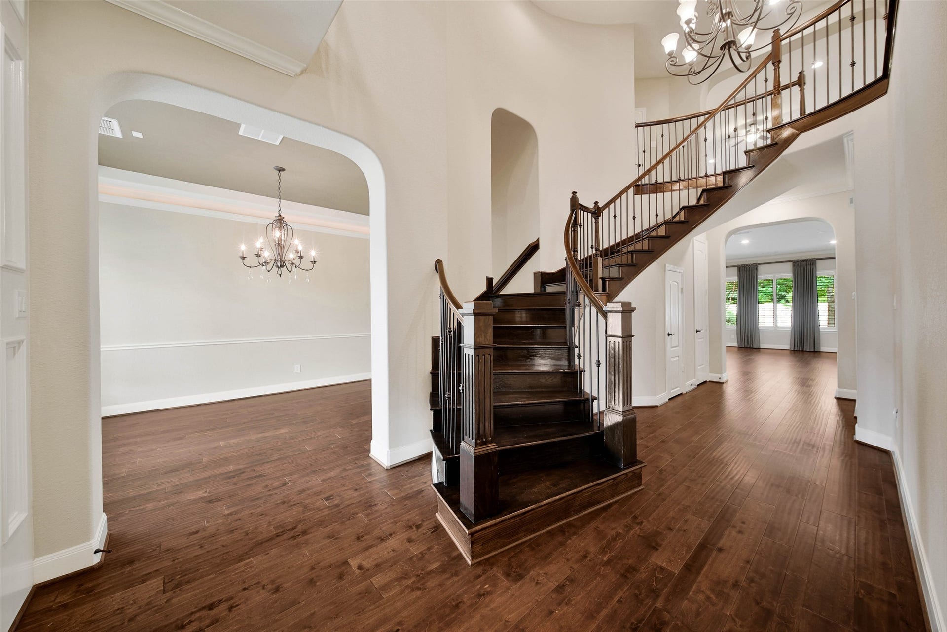 From the moment you step through the 8-foot double front doors, you'll appreciate the home's timeless elegance and thoughtful design. Rich wood floors warm almost the entire first floor of the home.