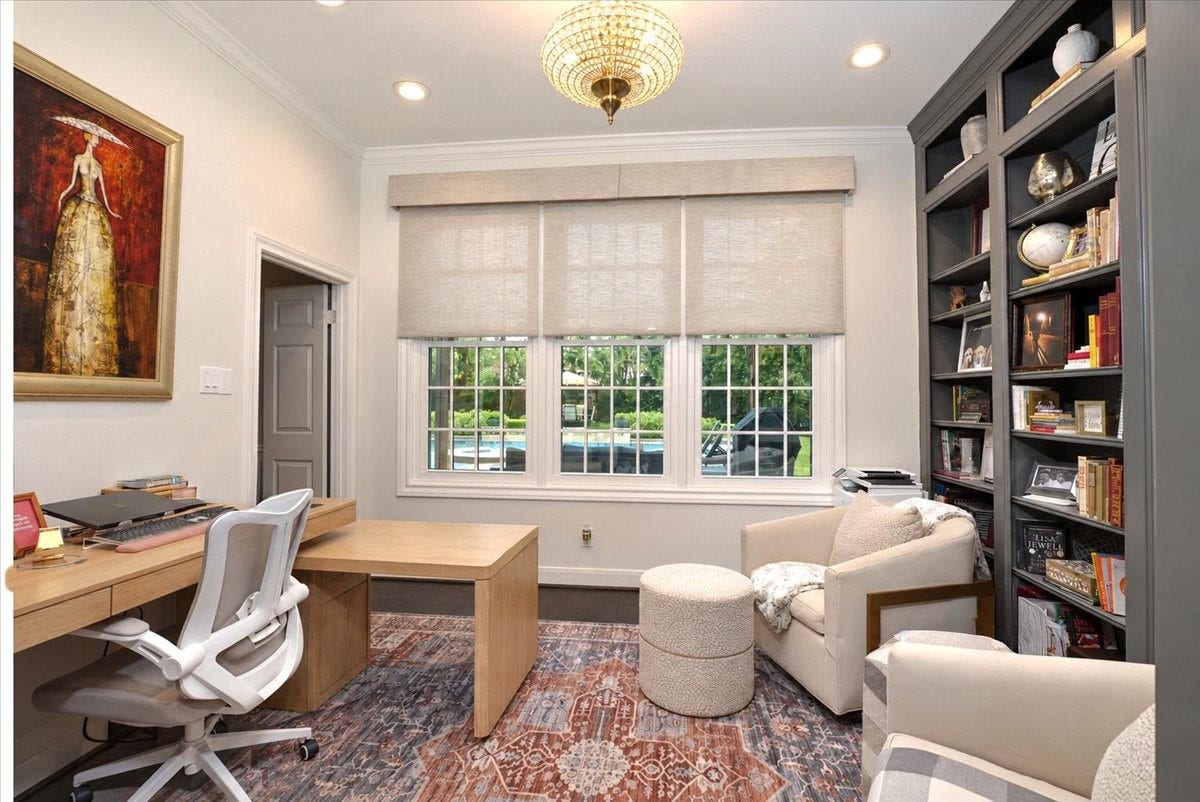 14026 Champions Hamlet Court, Houston, TX 77069 Pool views through the windows, custom built-ins for your books and keepsakes, and ceiling speakers for background music make this study as practical as it is elegant.