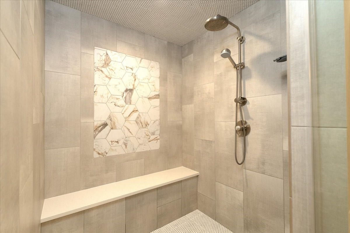 14026 Champions Hamlet Court, Houston, TX 77069 A rainfall showerhead with a handheld wand and a Canopy filter showerhead for softer hair and skin make daily routines feel effortless in this oversized walk-in shower.
