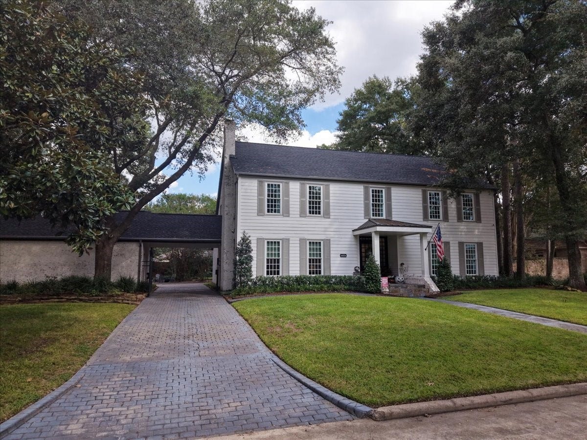 14026 Champions Hamlet Court, Houston, TX 77069 A paver driveway with a new gate (2022) leads to the covered porte cochere and three-car garage, so coming home and unloading the car stays easy, private, and out of the weather.