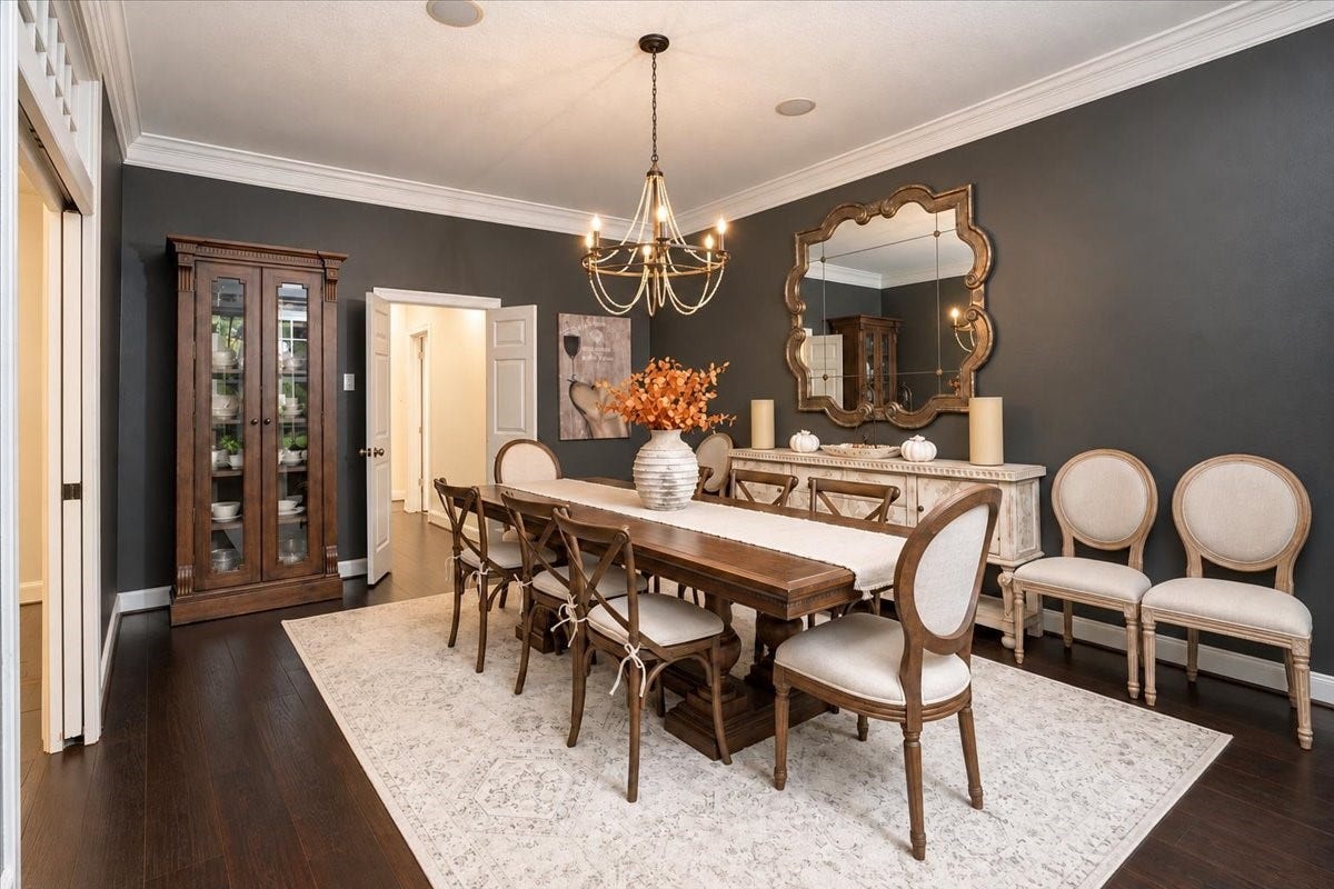 14026 Champions Hamlet Court, Houston, TX 77069 Holiday dinners, birthdays, and Sunday suppers all feel special here! This elegant formal dining room is wrapped in crown molding and dark hardwood floors, with a statement chandelier overhead and room for a table that seats the whole family.
