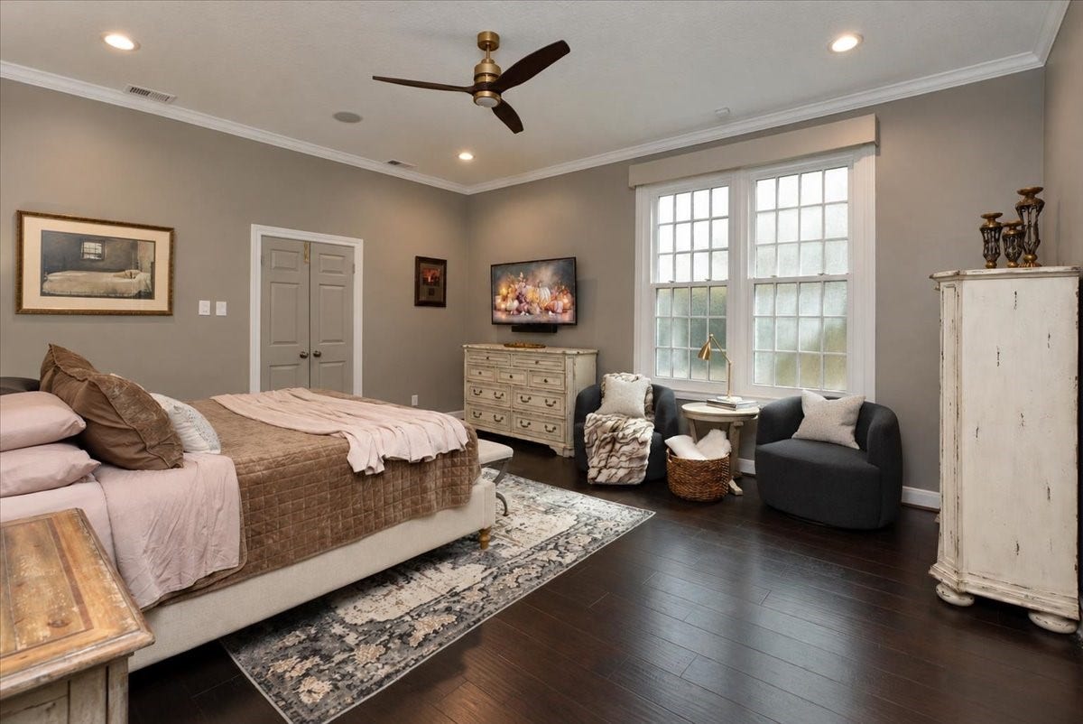 14026 Champions Hamlet Court, Houston, TX 77069 Light, bright, and peaceful. Automatic custom shades with remote, with blackout in the primary, let you set the mood from bed, while new triple-pane windows keep the room comfortable and quiet.