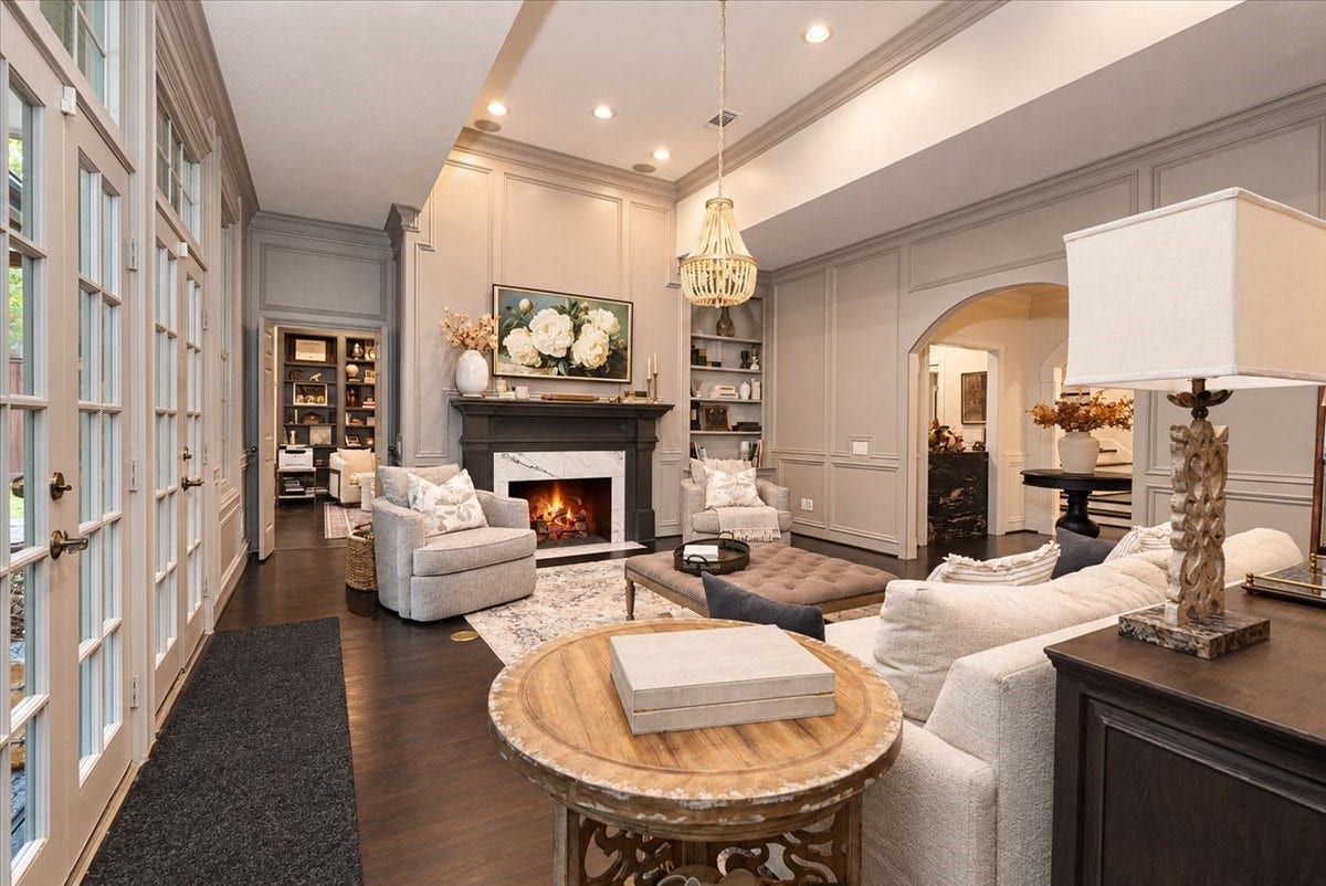 14026 Champions Hamlet Court, Houston, TX 77069 Dark hardwood floors and a beaded chandelier add warmth and a touch of luxury to every gathering.