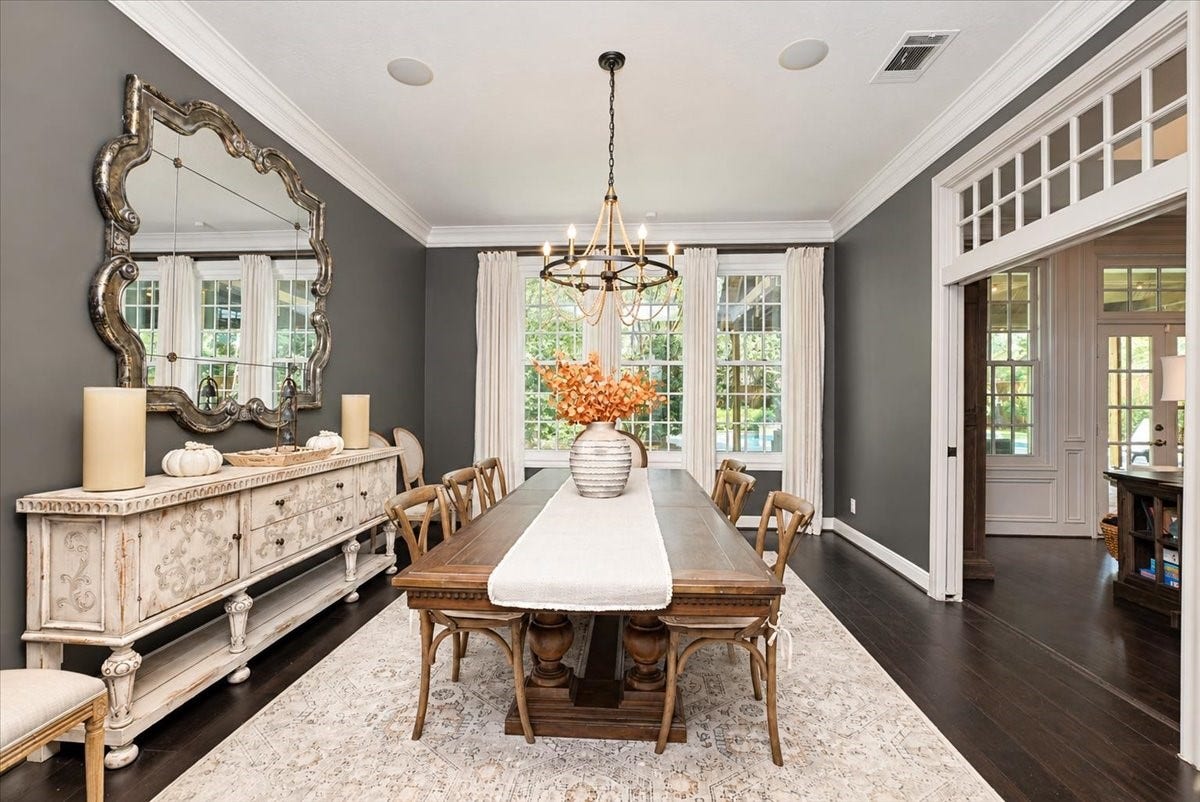 14026 Champions Hamlet Court, Houston, TX 77069 Custom French pocket doors open to the living room, so you can host a crowd of 12 at the table and let the party flow, with ceiling speakers and dimmer switches to set the mood.