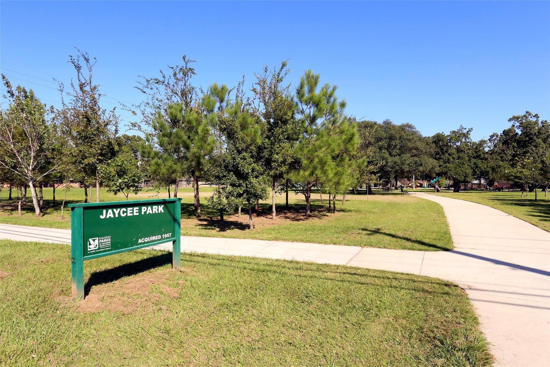 Nearby Jaycee Park with playground, splash pad, basketball, and tennis courts