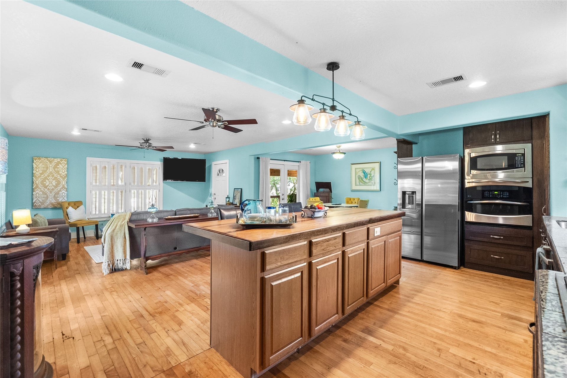 939 17th Street, Dickinson, TX 77539 Open kitchen overlooks the spacious living area and features a large center island with extensive workspace and storage