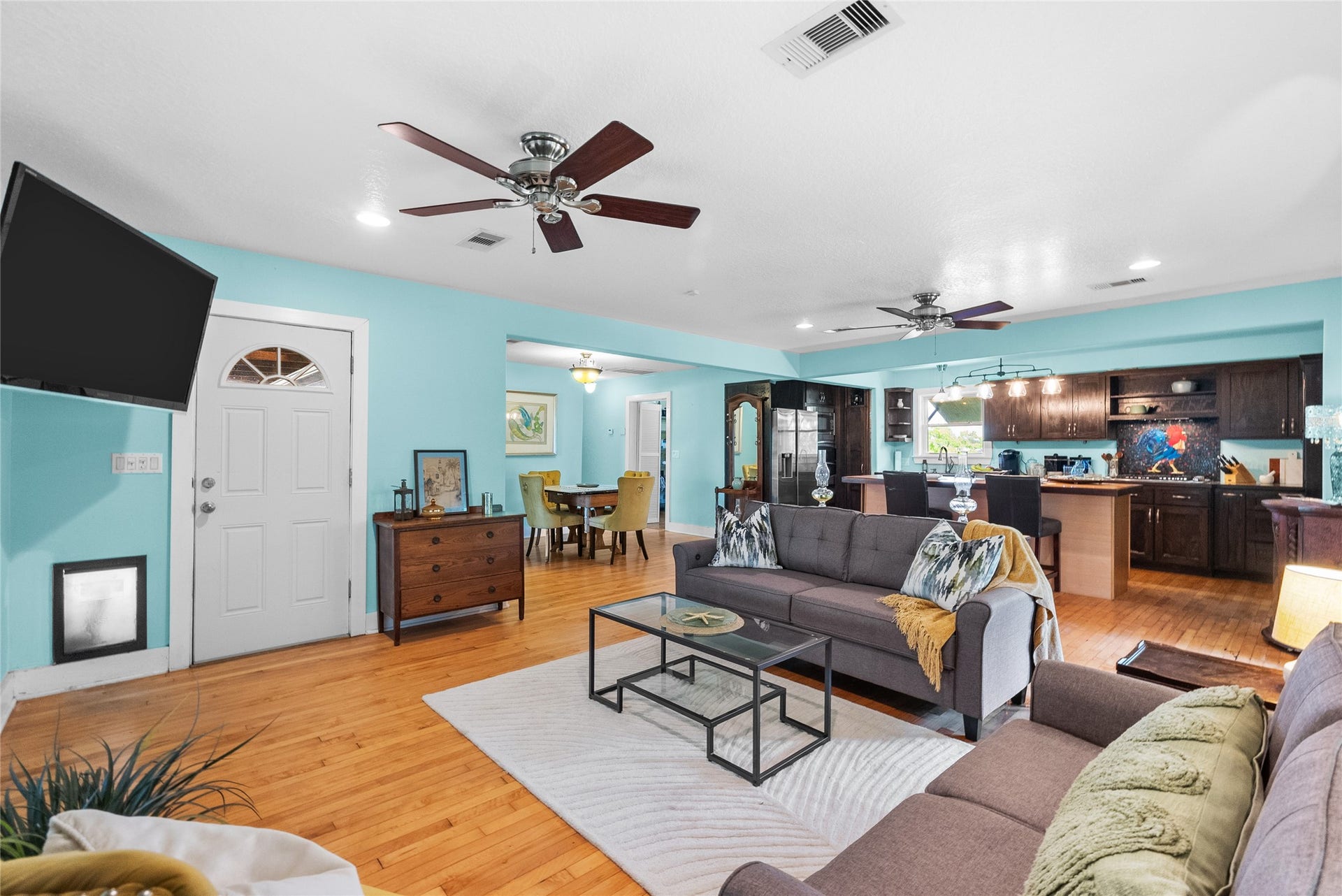 939 17th Street, Dickinson, TX 77539 Open-concept living area connects seamlessly with the kitchen and dining spaces creating a comfortable layout for everyday living and entertaining