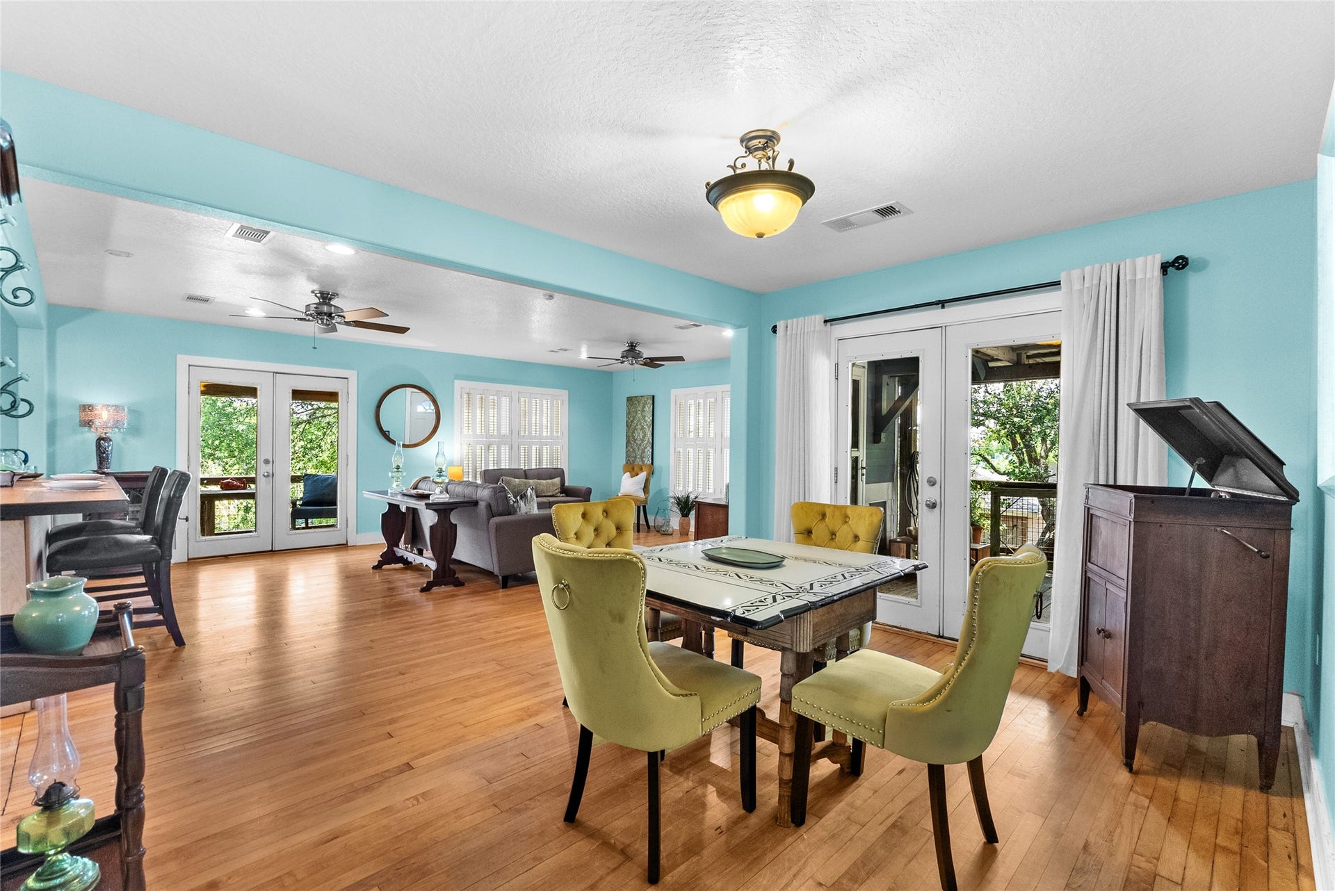939 17th Street, Dickinson, TX 77539 Dining area positioned just off the kitchen and living room with hardwood flooring and French doors opening to the exterior