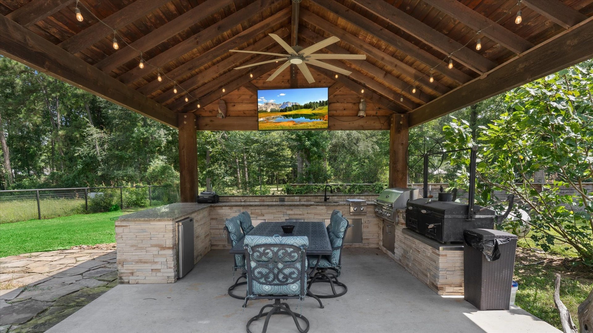 23963 Majestic Forest, New Caney, TX 77357 Outdoor kitchen with burners, grill, smoker, fridge and sink