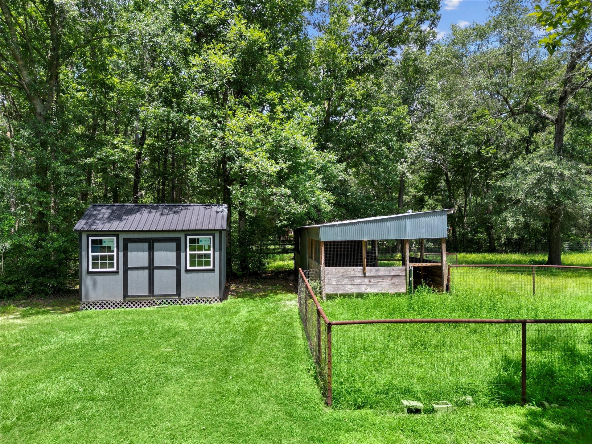 23963 Majestic Forest, New Caney, TX 77357 Storage Shed behind stable and holding pens