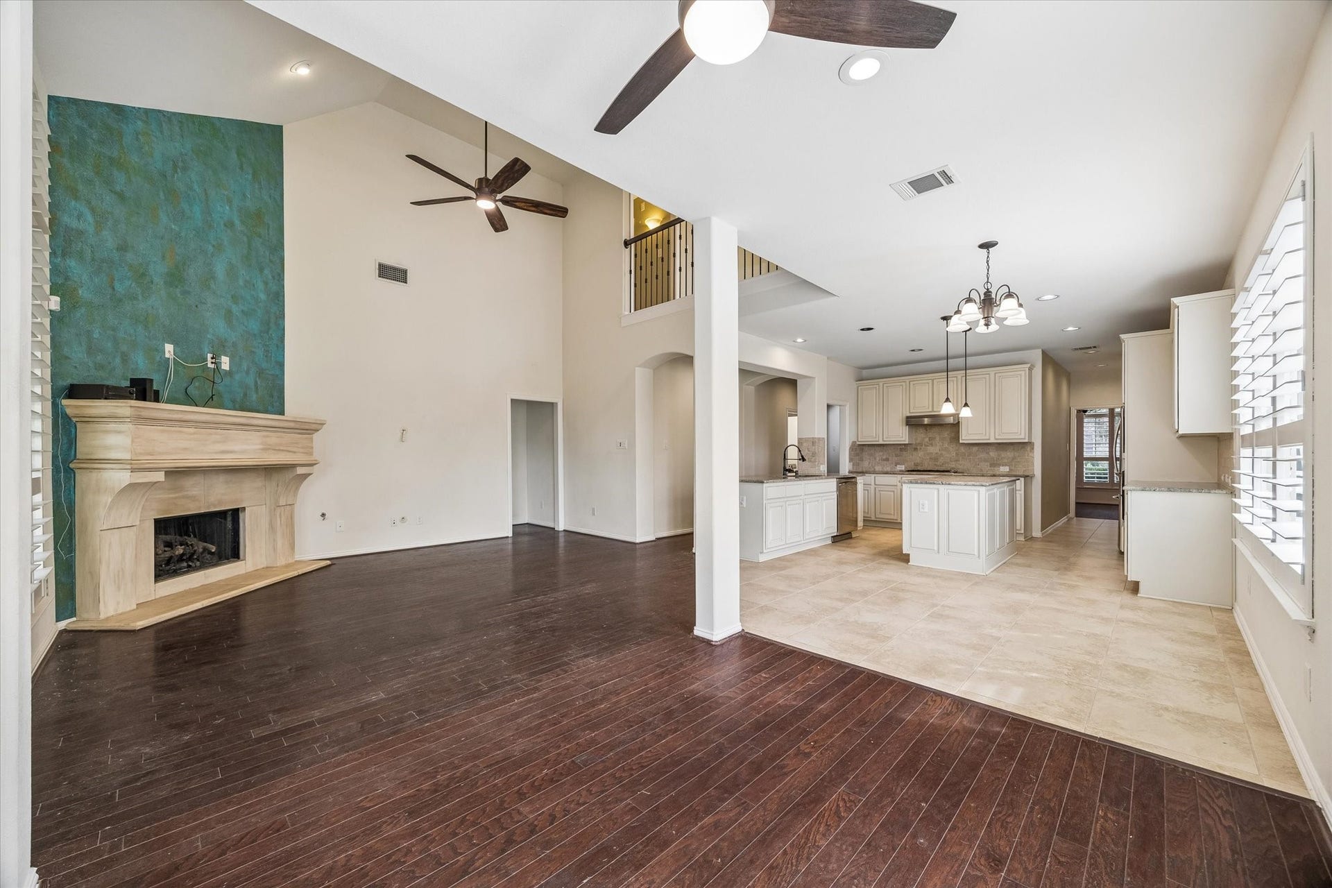 Family room opens to the island kitchen and breakfast area, offering generous space for gathering.