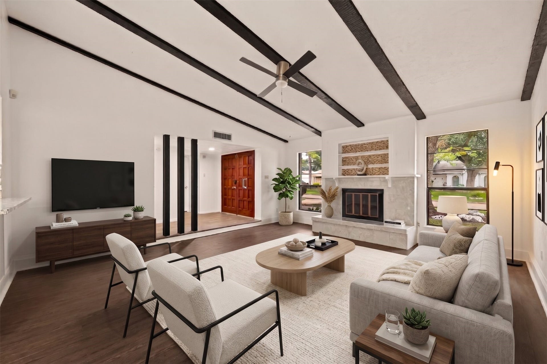 5515 Dunnethead Drive, Houston, TX 77084 A feature fireplace and soaring ceilings make this living room the beating heart of the home.