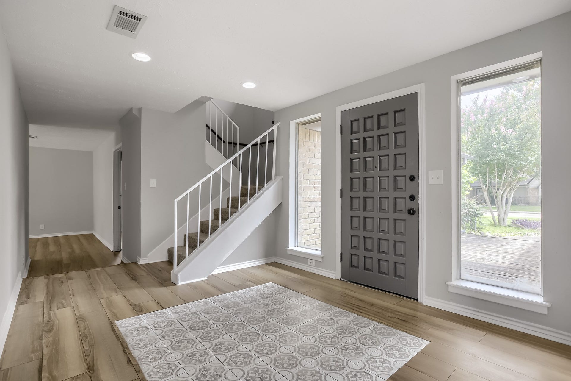 16505 Cornwall Street, Jersey Village, TX 77040 Welcoming entryway seamlessly connects to the den and kitchen, offering a warm and inviting flow.