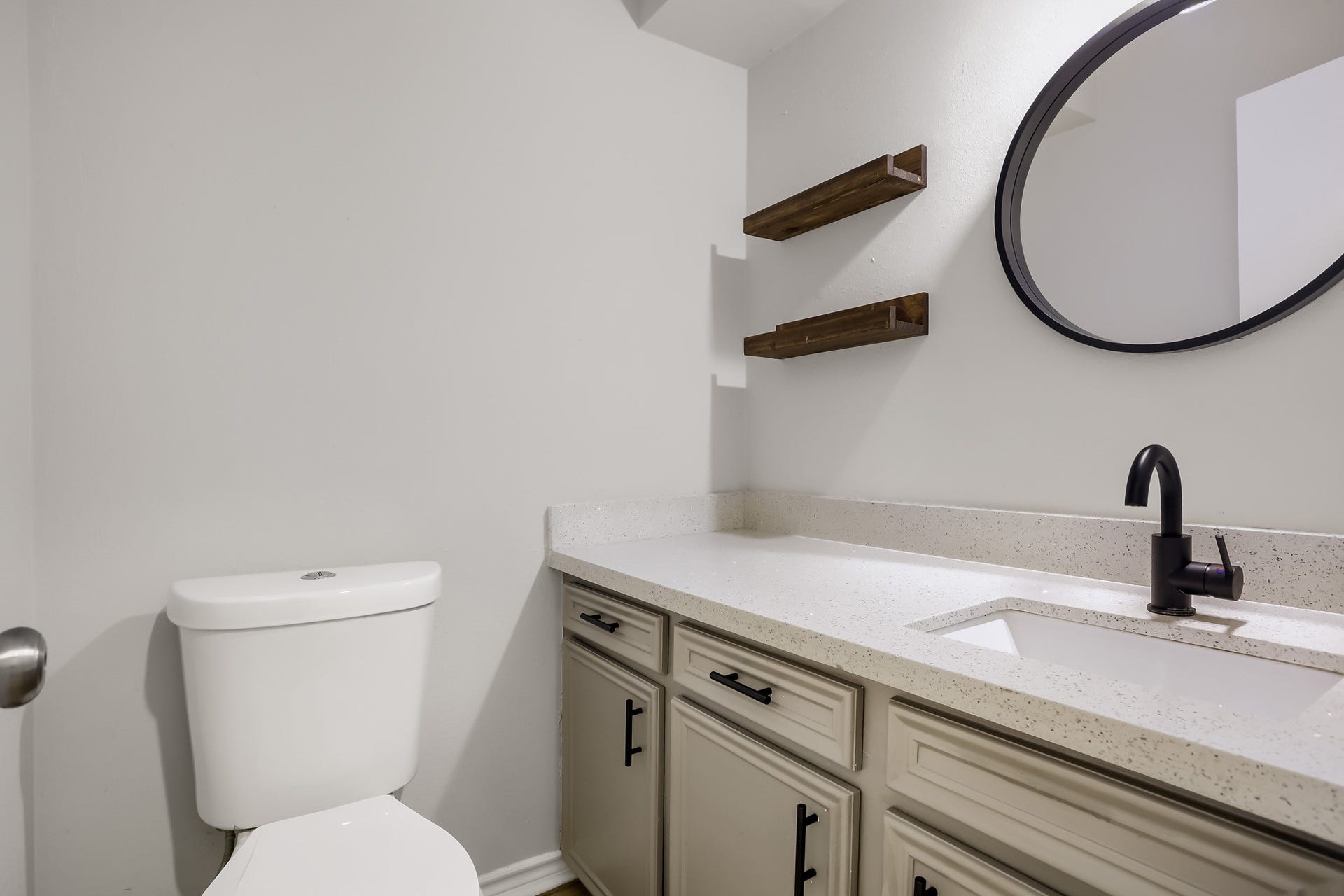 16505 Cornwall Street, Jersey Village, TX 77040 Chic and functional first-floor primary bath with modern fixtures and ample storage.