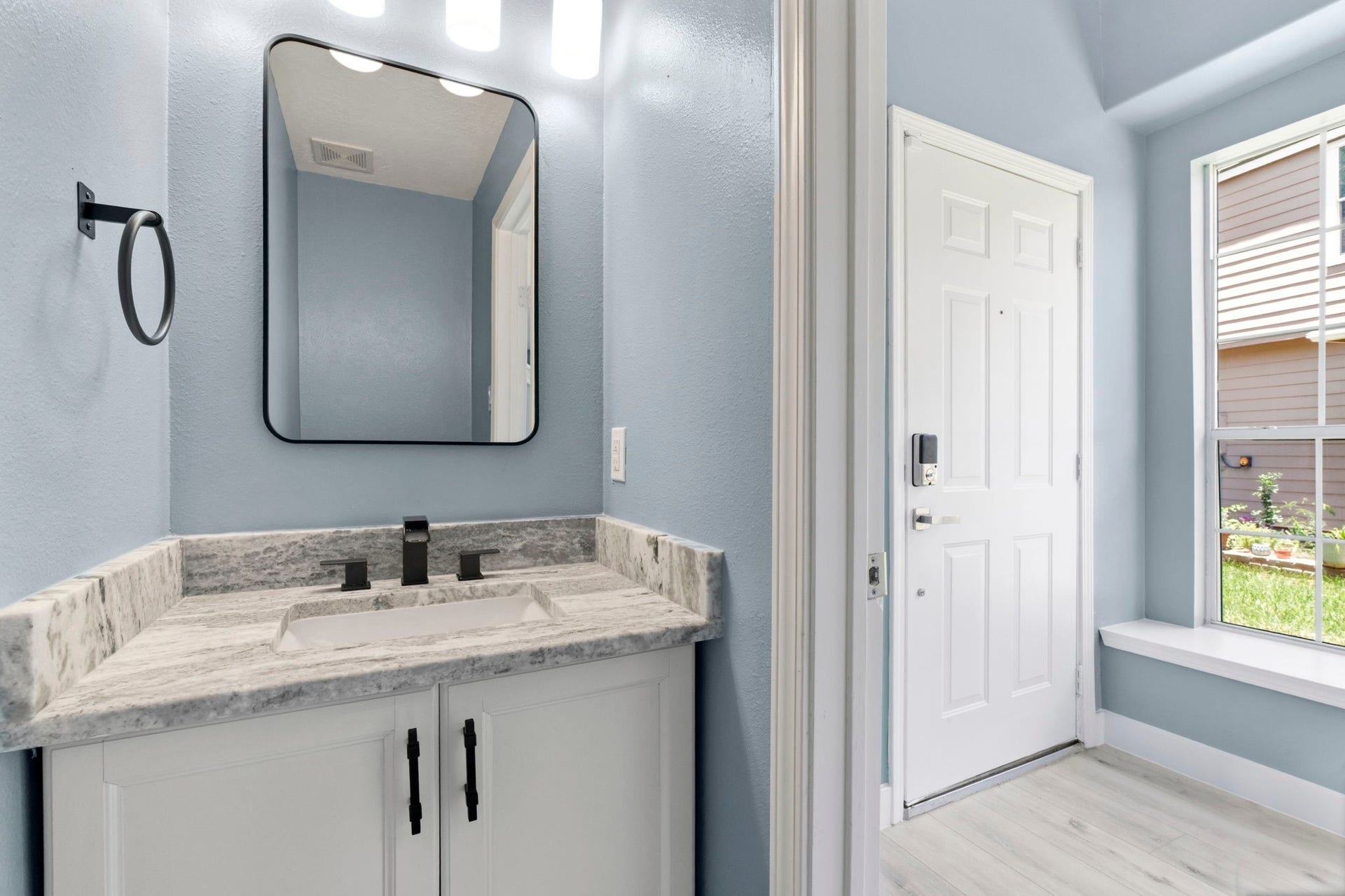 238 Drake Run Lane, Dickinson, TX 77539 Powder Room features granite countertops, designer mirrors, light fixtures, and elongated commode
