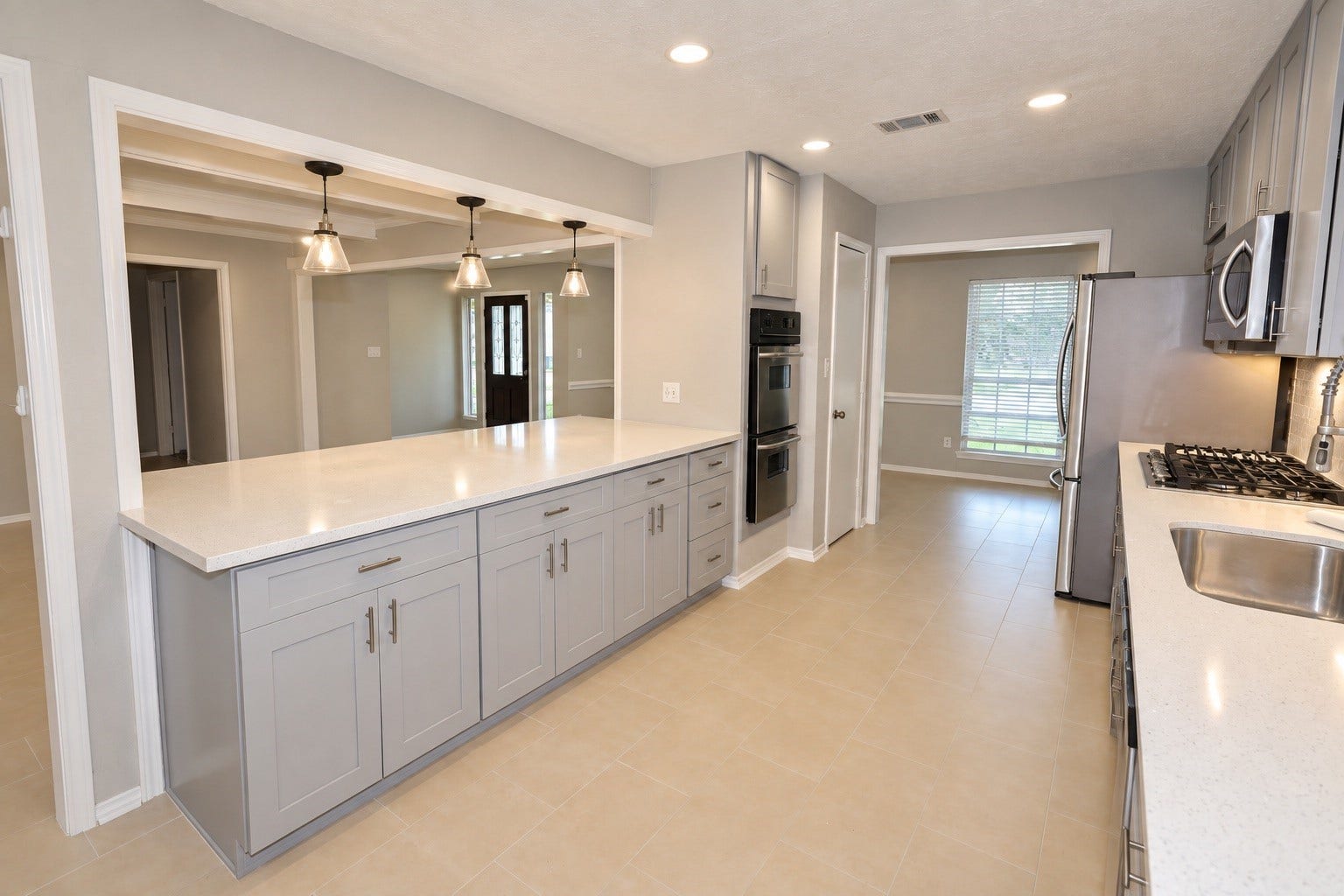 12034 Meadowdale Drive, Meadows Place, TX 77477 Kitchen entrance featuring ample cabinet space and a convenient double oven
