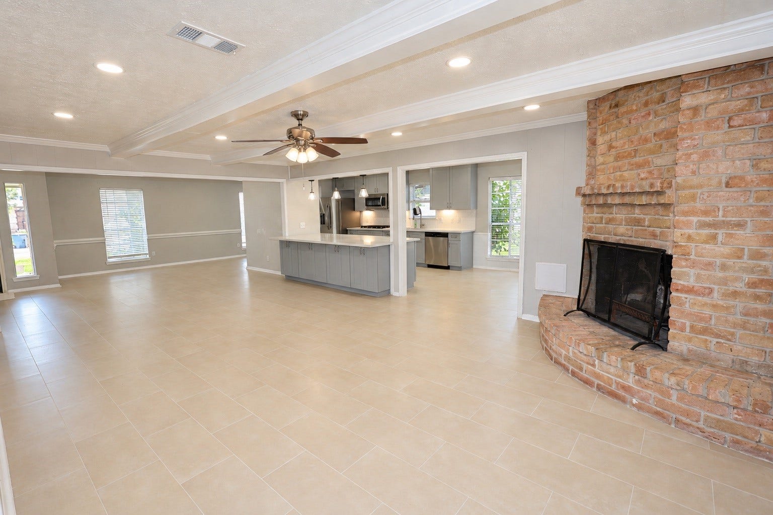 12034 Meadowdale Drive, Meadows Place, TX 77477 The living room opens up to the newly renovated kitchen and breakfast room