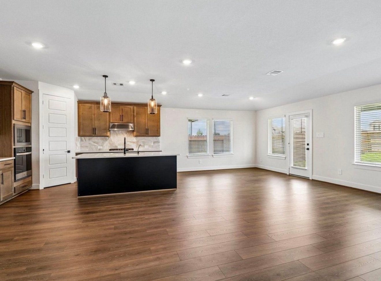 Another view of kitchen with living room area