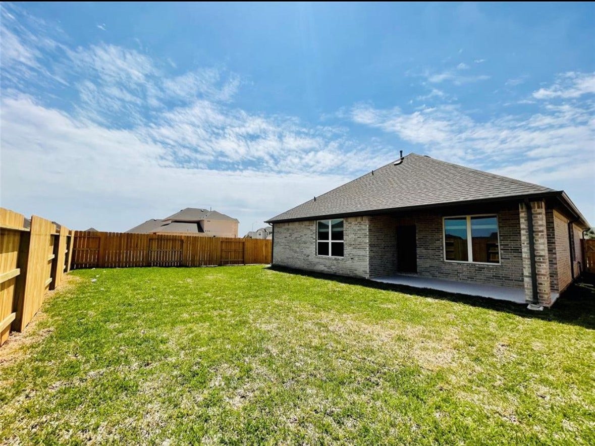 Oversized backyard with covered patio