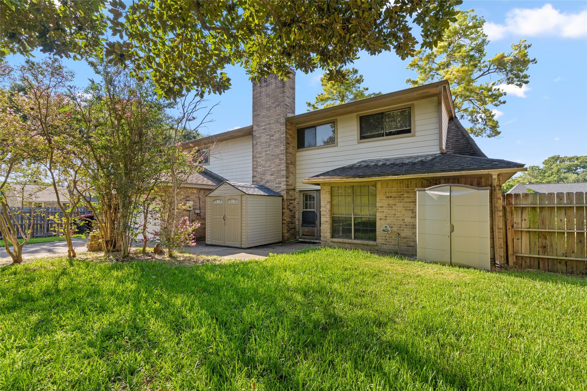 Mature trees, a generous lawn, and the privacy of the fenced outdoor space create a peaceful backdrop with room to enjoy the outdoors and make the property feel distinctly your own.