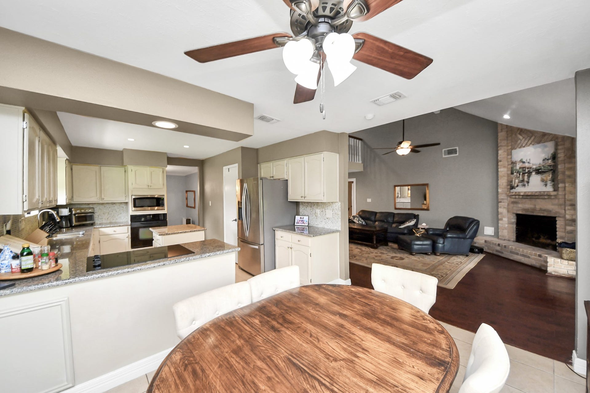 1710 Mayweather Lane, Richmond, TX 77406 The kitchen and breakfast area open seamlessly to the main living space, creating an ideal layout for everyday living.