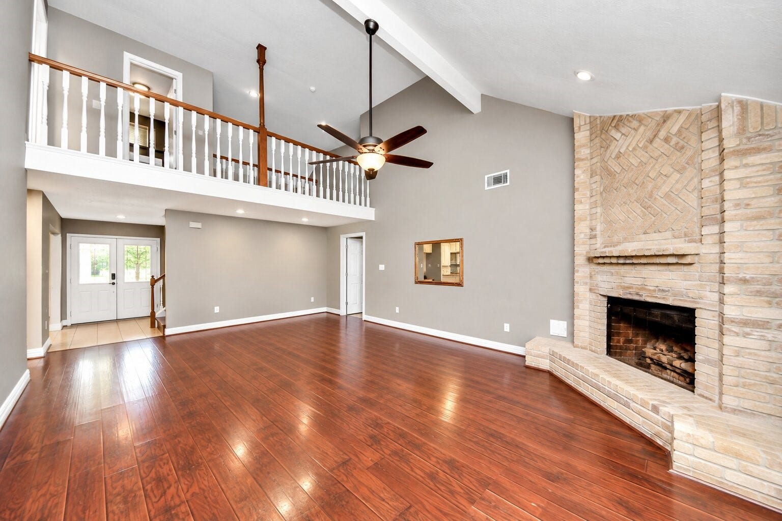 1710 Mayweather Lane, Richmond, TX 77406 A family room for entertaining with soaring ceilings anchored by an eye-catching fireplace. Welcome to 1710 Mayweather Lane in Pecan Grove in Richmond, Texas.