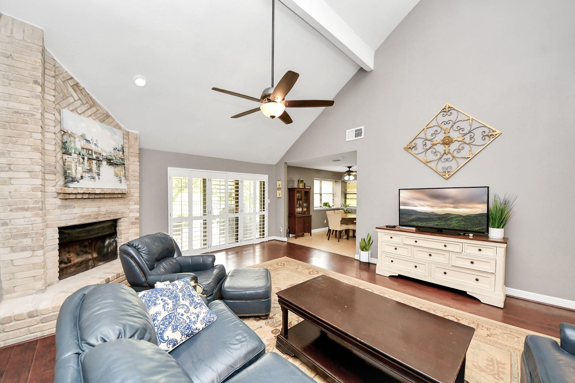 1710 Mayweather Lane, Richmond, TX 77406 Two-story family room features a fireplace, soaring ceiling and an open feel, with plenty of space for comfortable seating and everyday living.