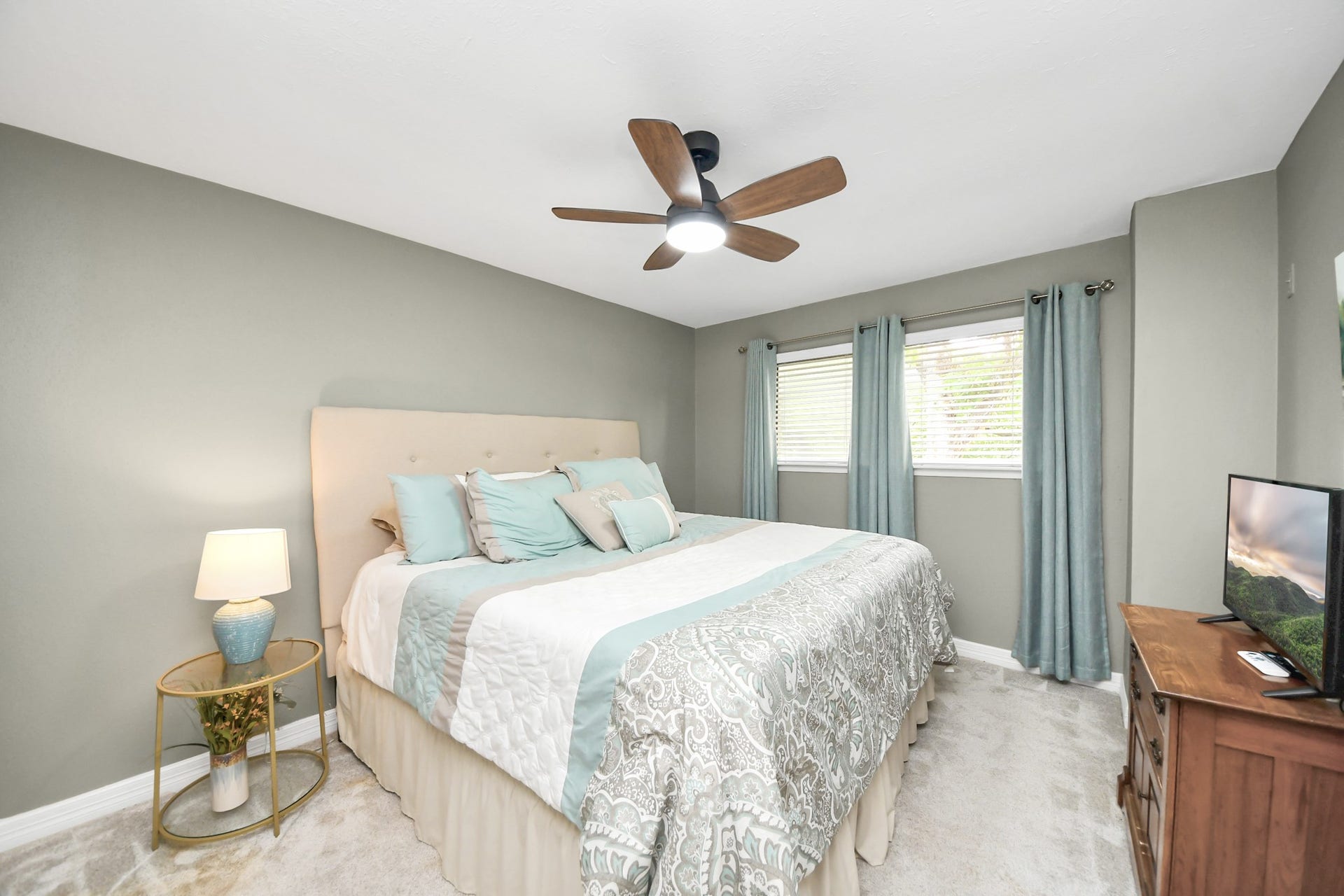 1710 Mayweather Lane, Richmond, TX 77406 Inviting secondary bedroom featuring soft neutral finishes, plush carpet, updated ceiling fan, and abundant natural light.