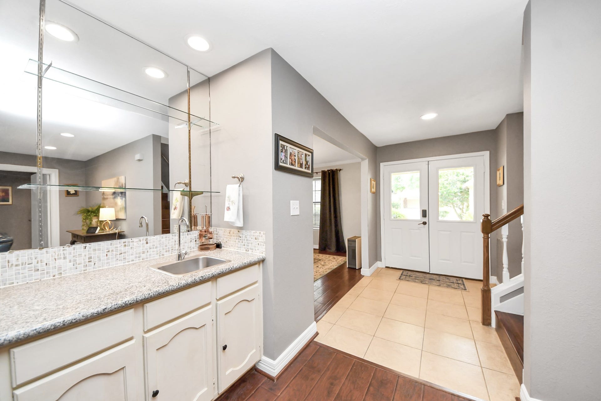 1710 Mayweather Lane, Richmond, TX 77406 A wet bar with storage and serving space enhances entertaining and everyday convenience.