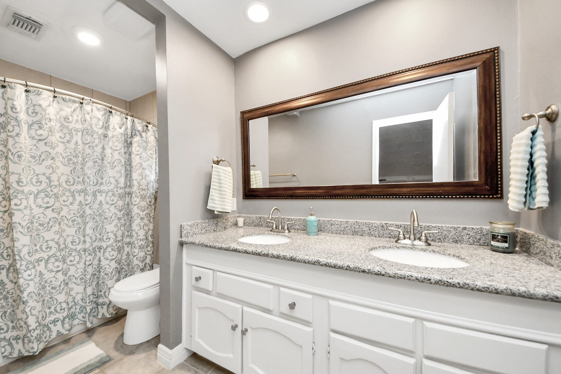1710 Mayweather Lane, Richmond, TX 77406 Shared secondary bath featuring dual sinks, granite countertops, and abundant storage.