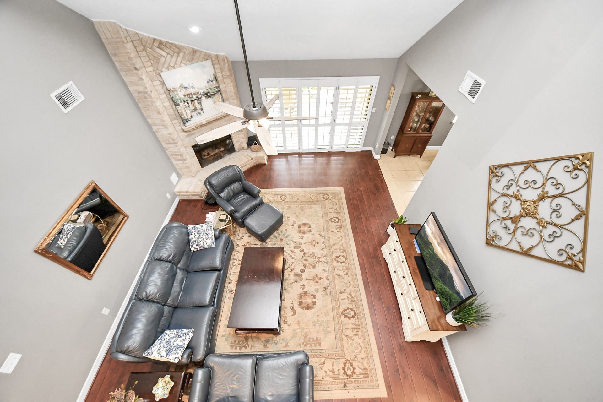1710 Mayweather Lane, Richmond, TX 77406 An open overlook offers a unique perspective of the dramatic two-story family room below.