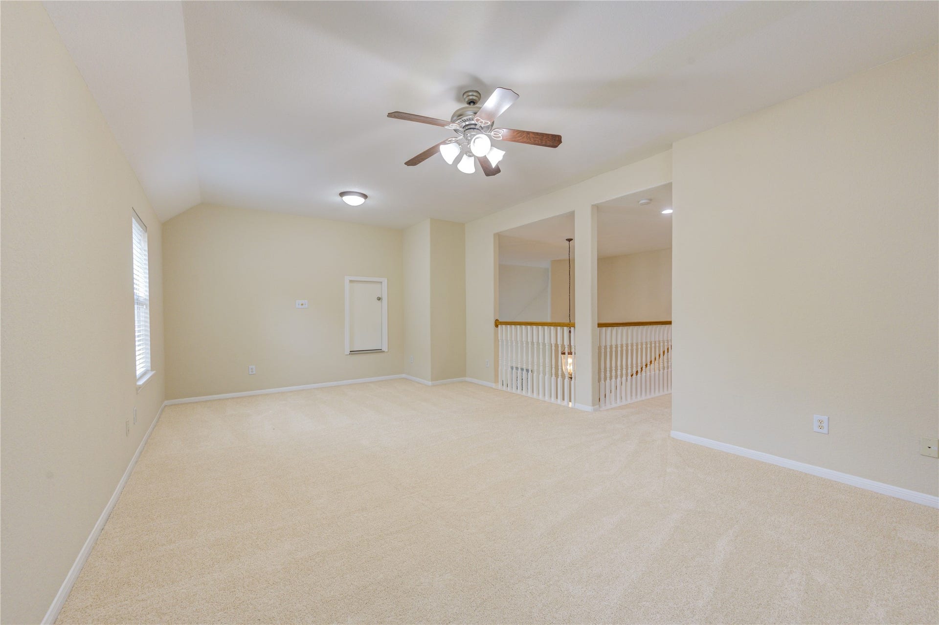 7811 Ravens Point Drive, Richmond, TX 77406 Expansive game room offering flexible space for movie nights, playroom setup, or entertaining guests.
