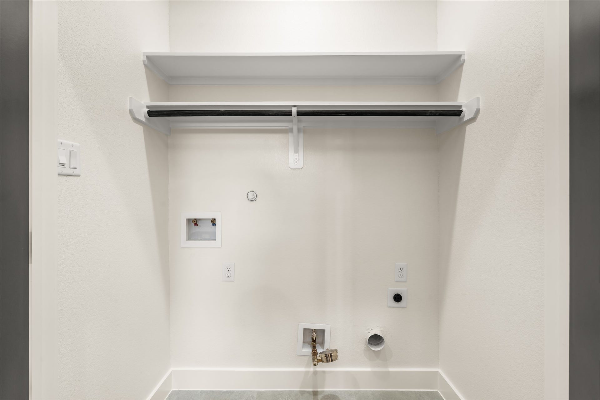5321 Rue Street, Houston, TX 77033 Dedicated laundry niche upper storage shelf, hanging rod, and fully hookup-ready setup.