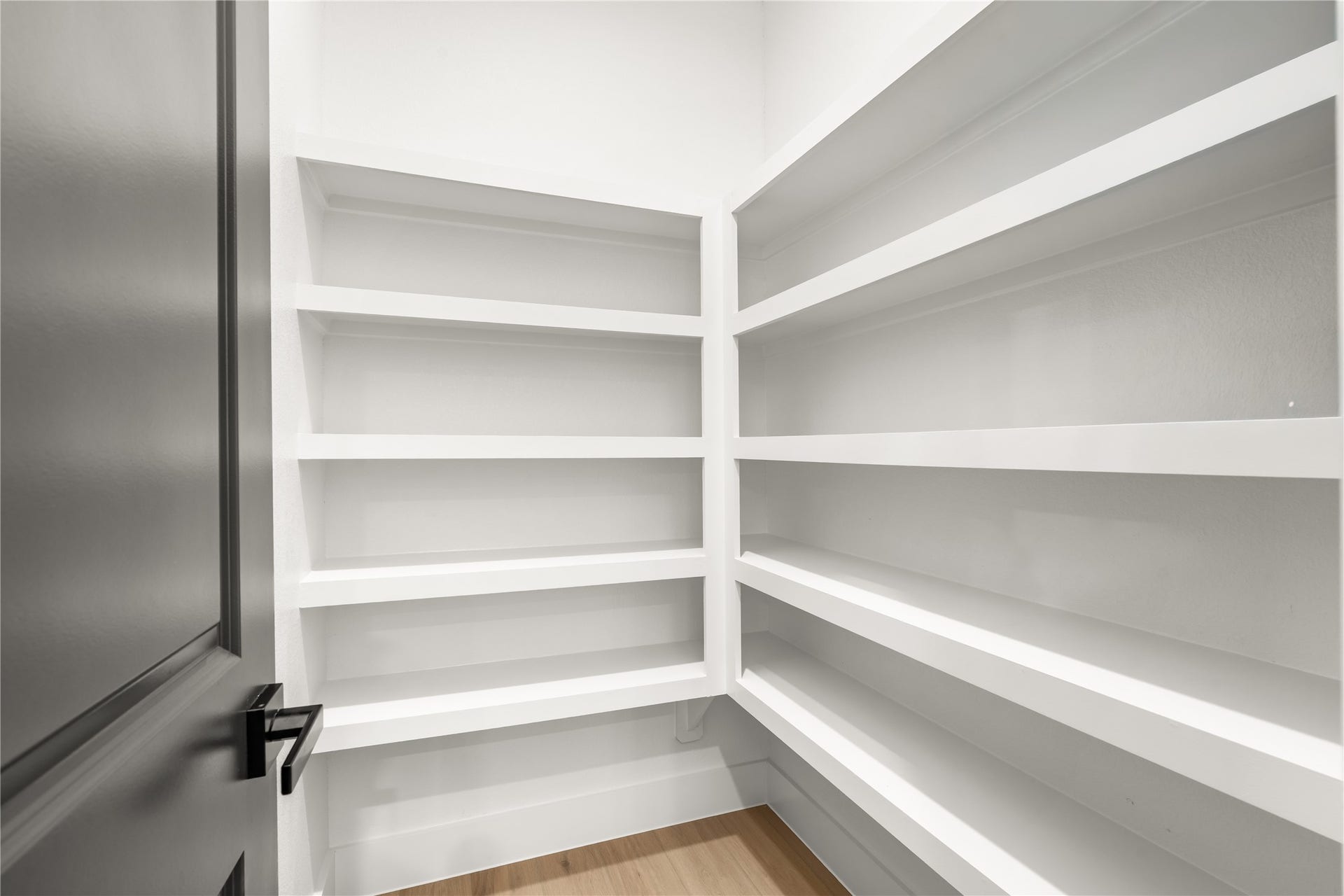 5321 Rue Street, Houston, TX 77033 Spacious walk-in pantry floor-to-ceiling custom built-in shelving providing exceptional storage organization.