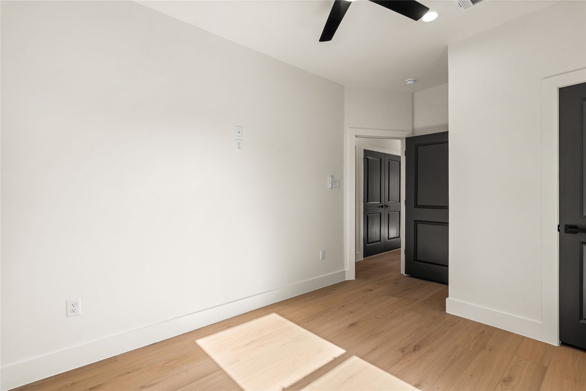 5321 Rue Street, Houston, TX 77033 Flexible bedroom layout ideal for guest room or home office setup with pre-wired media connections and dark contrast doors.