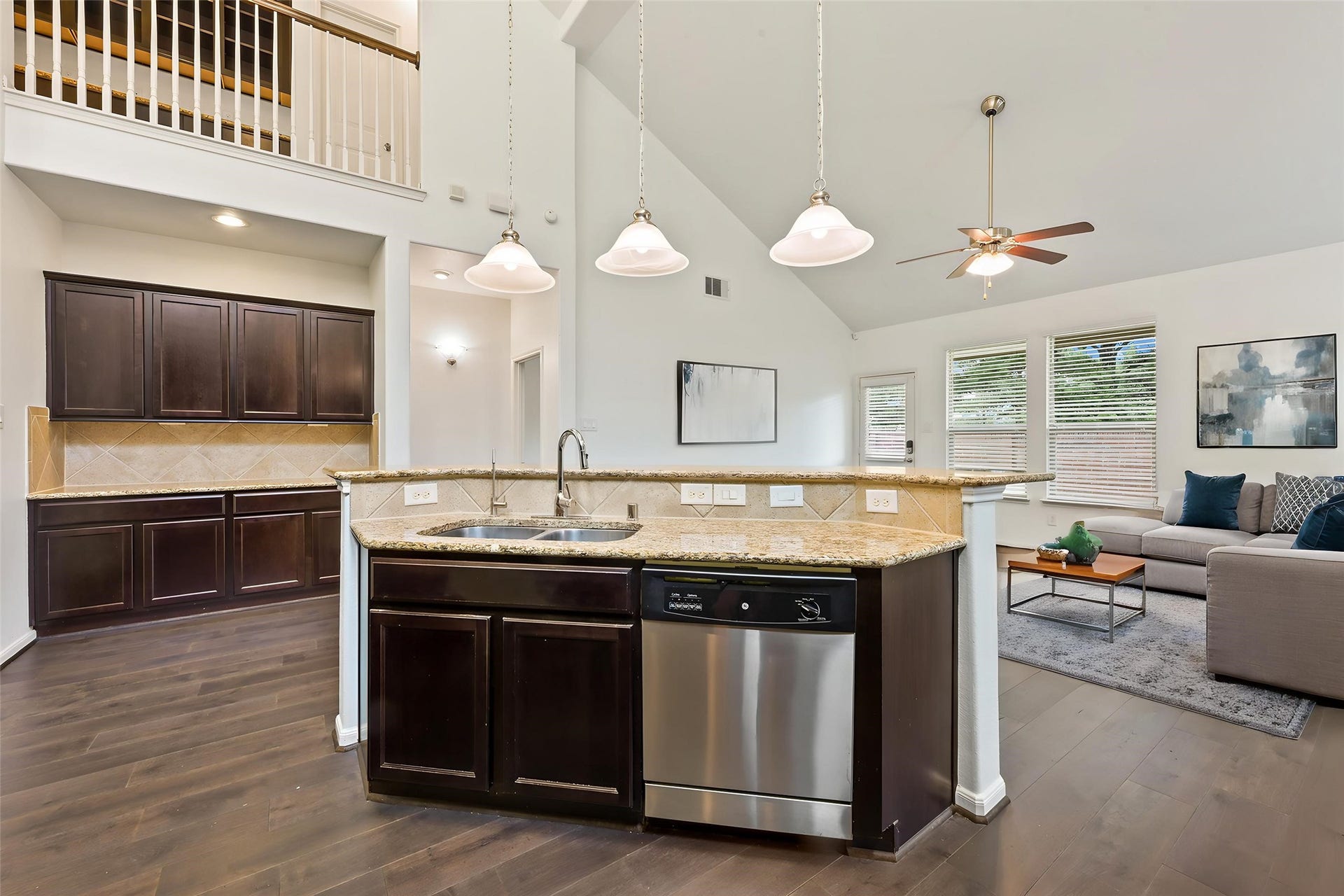 Large island kitchen overlooking the living and dining areas.