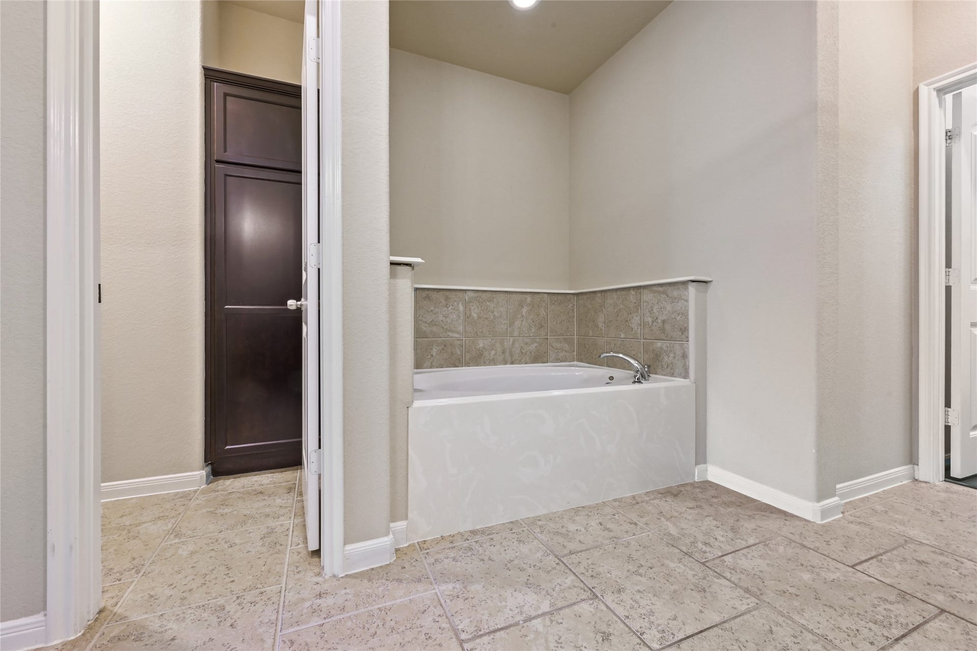 Relaxing primary bath with soaking tub and separate shower.
