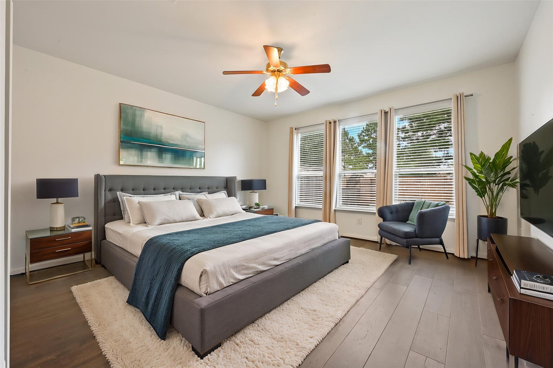 Expansive living area with large windows overlooking the backyard.