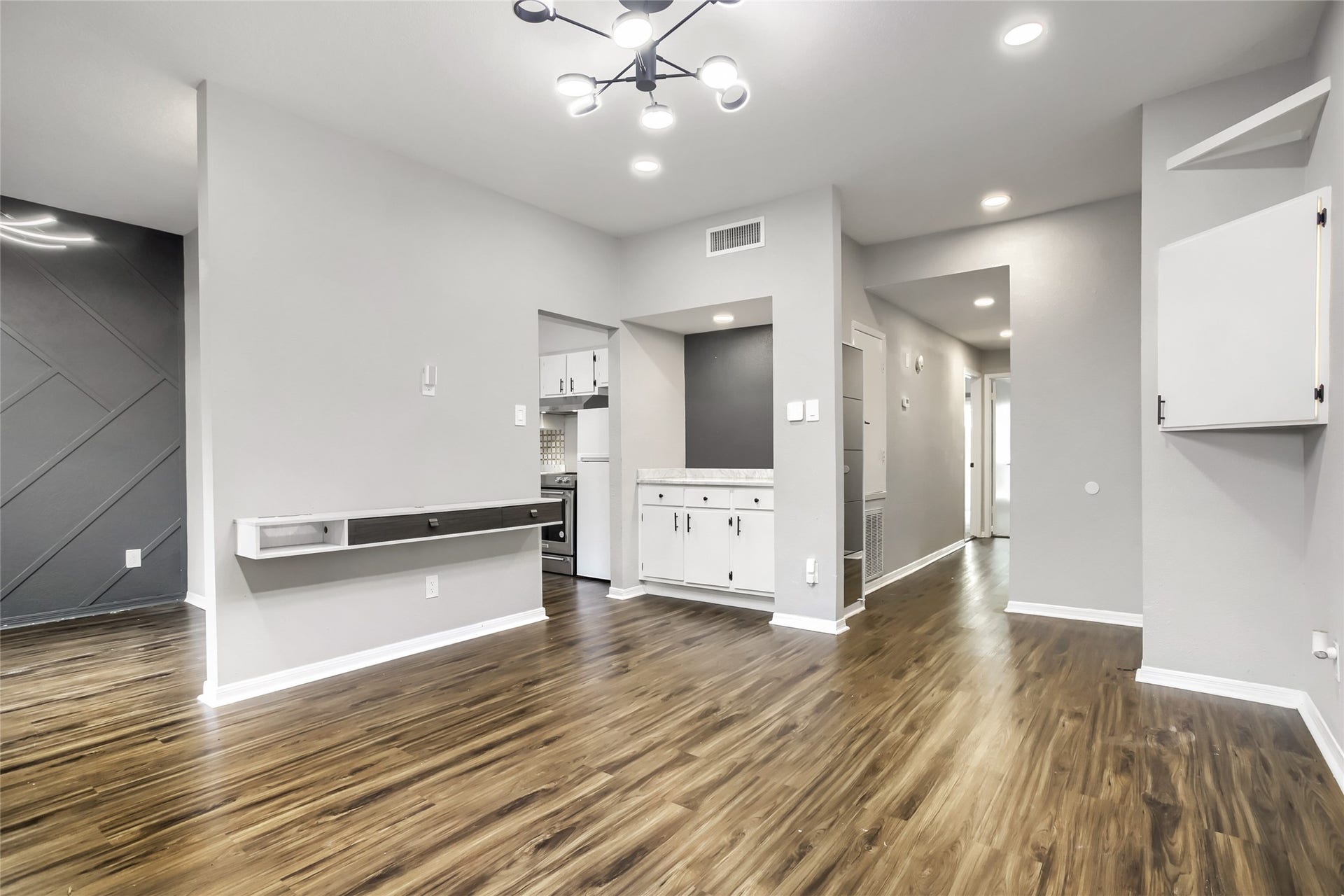 1818 Augusta Drive, #13, Houston, TX 77057 Butlers Pantry. Floating Mounted Wall Shelving w/ charging station storage and outlets