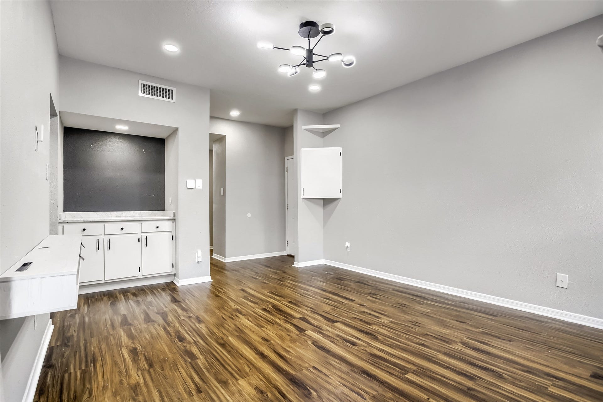 1818 Augusta Drive, #13, Houston, TX 77057 Corner Cabinet holds security and smart home devices w/ lighting