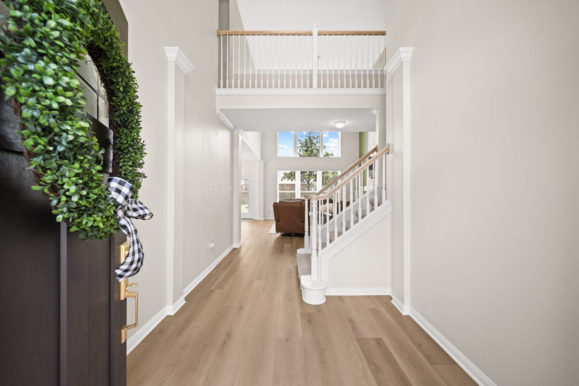 403 Trail Head Street, Friendswood, TX 77546 Grand foyer with soaring ceilings, abundant natural light, and an impressive sense of arrival that sets the tone for the elegance found throughout the home.