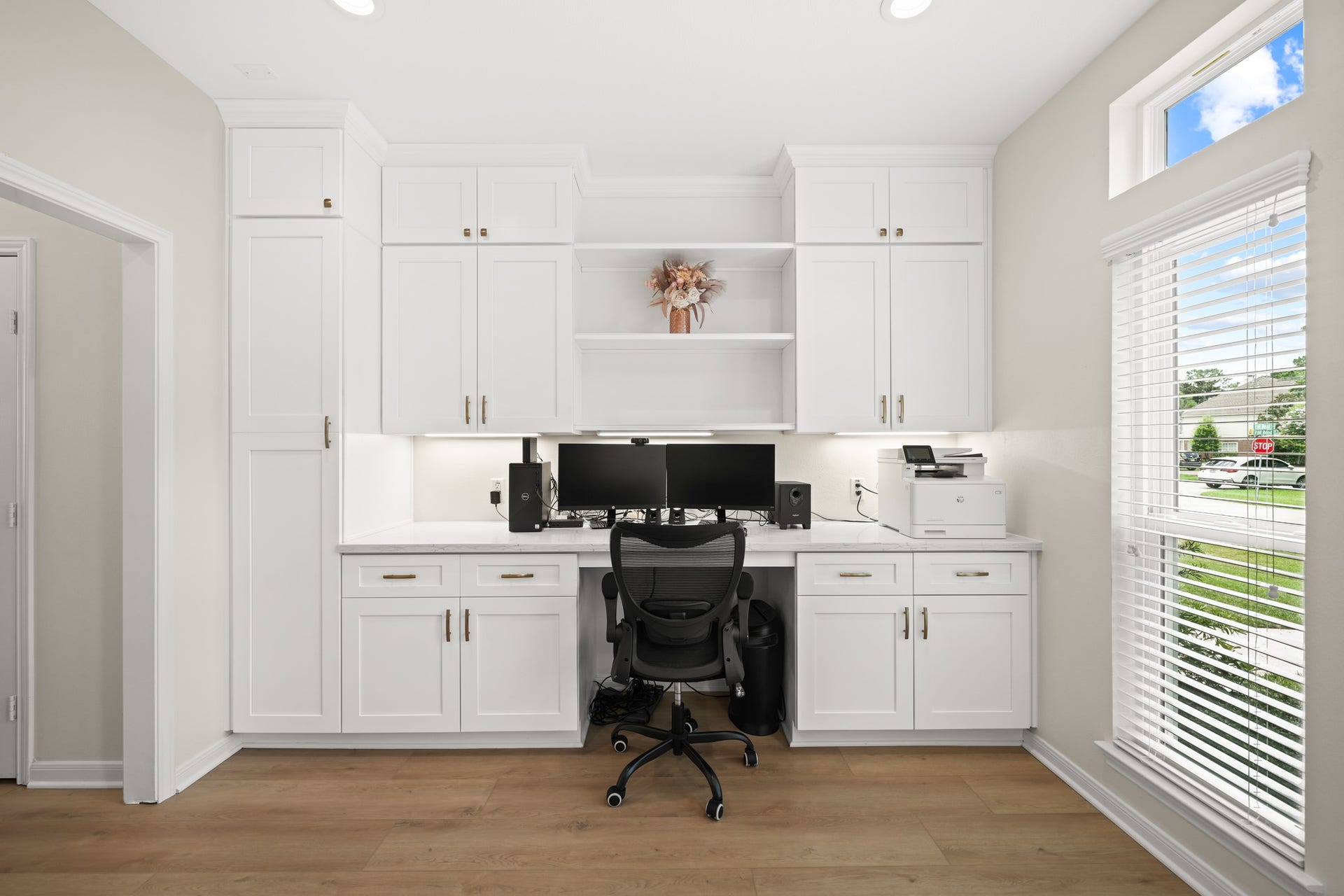 403 Trail Head Street, Friendswood, TX 77546 Designed with functionality in mind, this oversized office offers extensive custom built-ins, abundant storage, and a discreetly concealed laundry area with additional shelvingdelivering the thoughtful details often found in custom luxury homes.