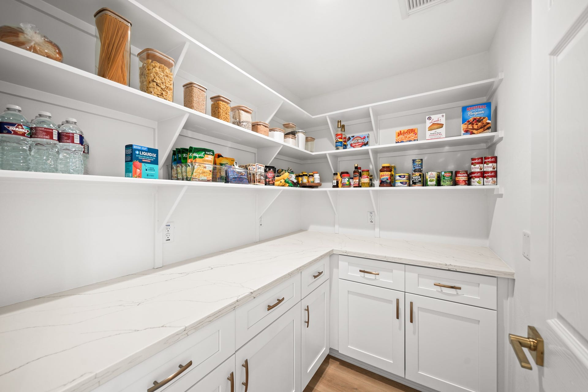 403 Trail Head Street, Friendswood, TX 77546 This dream pantry delivers the kind of refined storage and functionality typically reserved for custom luxury homes.