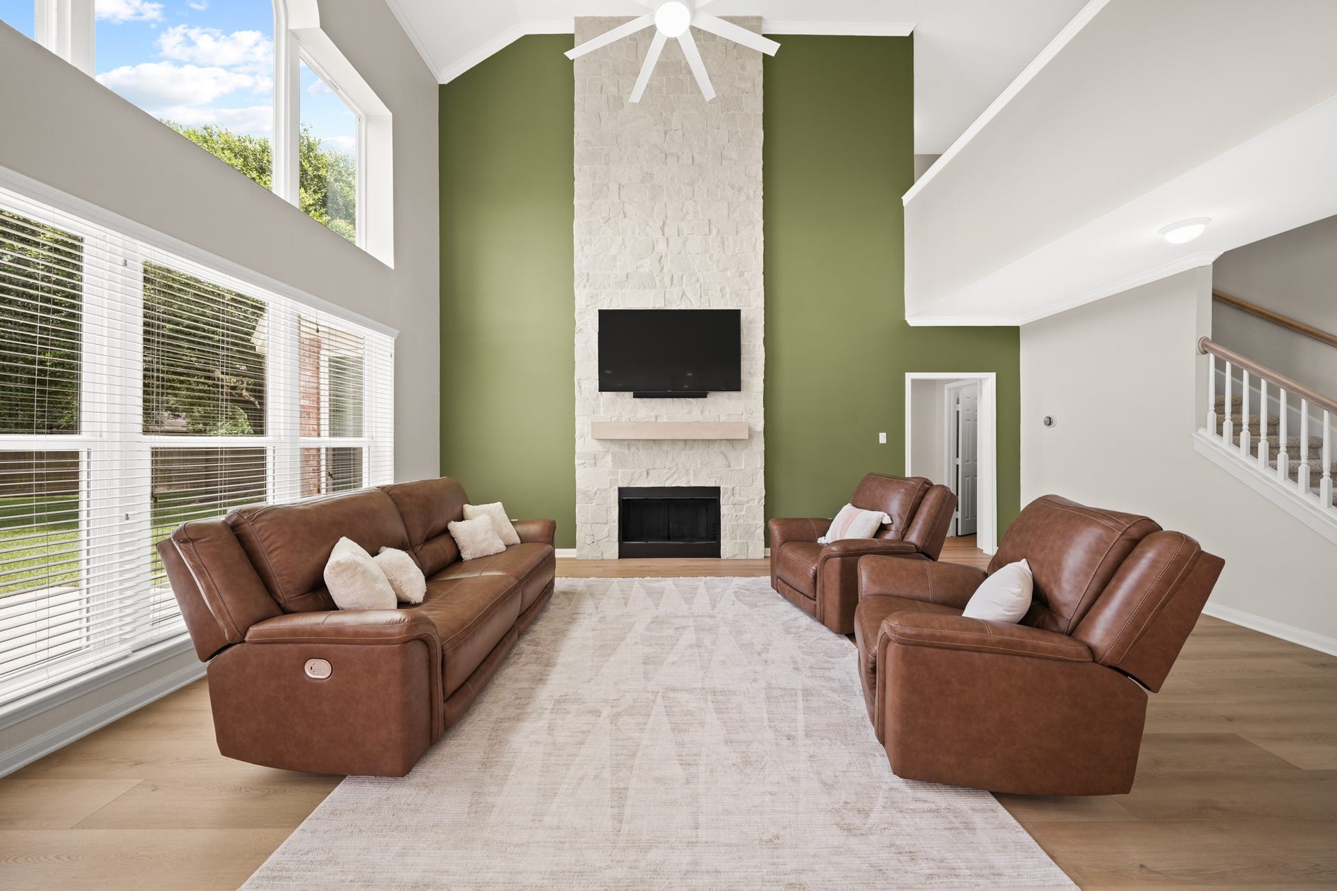 403 Trail Head Street, Friendswood, TX 77546 The stunning floor to ceiling stone fireplace is a beautiful focal point of the living space.