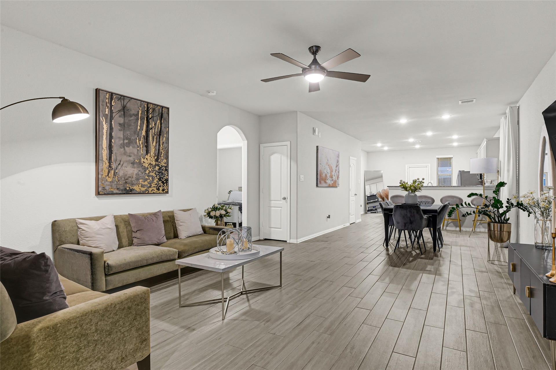31607 Eldorado Lane, Fulshear, TX 77441 Open living space with updated celling fan and tile in the main areas.