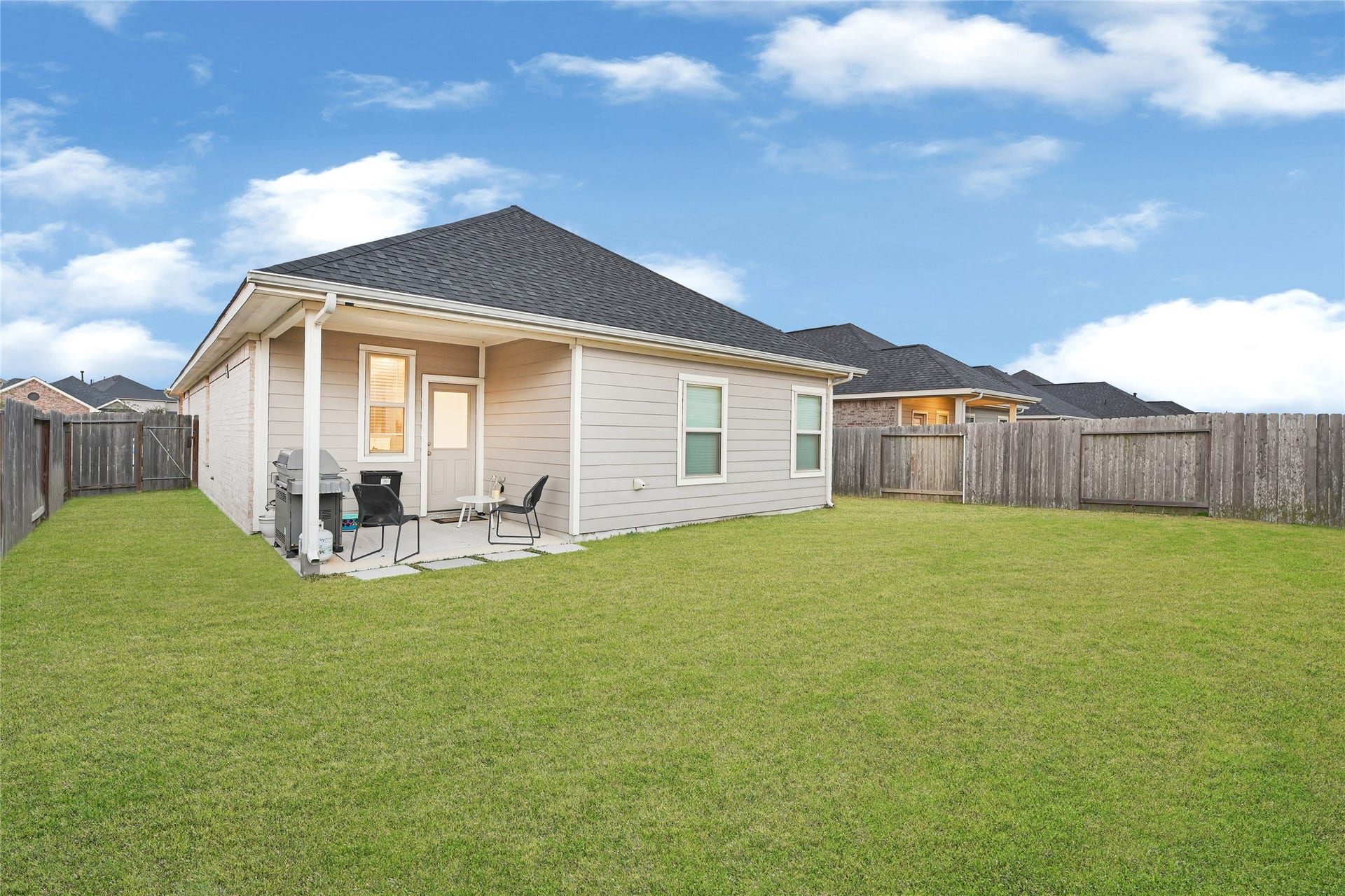 31607 Eldorado Lane, Fulshear, TX 77441 Spacious back yard with covered patio.