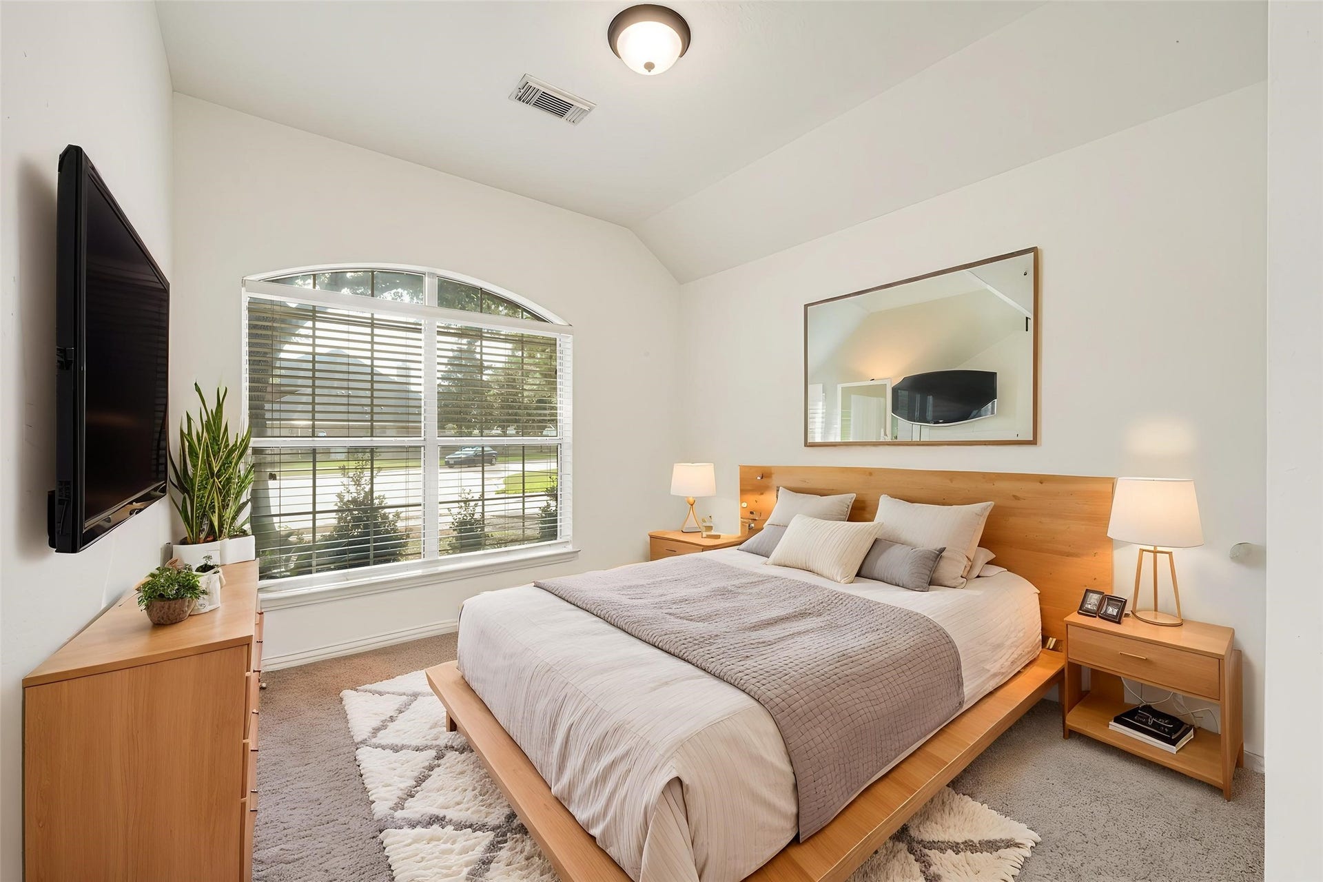 7102 Hollow Field Lane, Cypress, TX 77433 Virtually Staged: Bright secondary bedroom featuring plush carpeting, crisp neutral paint, and an elegant arched window that fills the space with natural light.