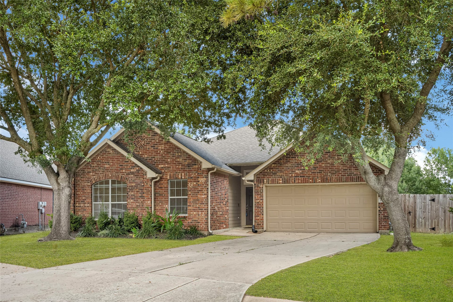 7102 Hollow Field Lane, Cypress, TX 77433 An alternative view highlighting the homes striking traditional elevation, expansive front yard, and clean architectural lines.