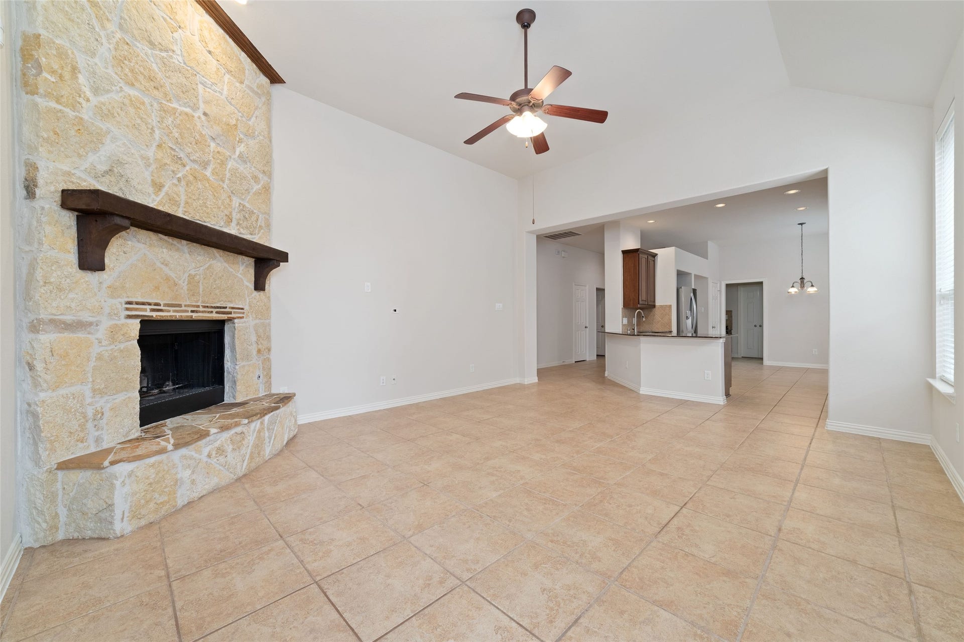 Living room looking back into open concept kitchen
