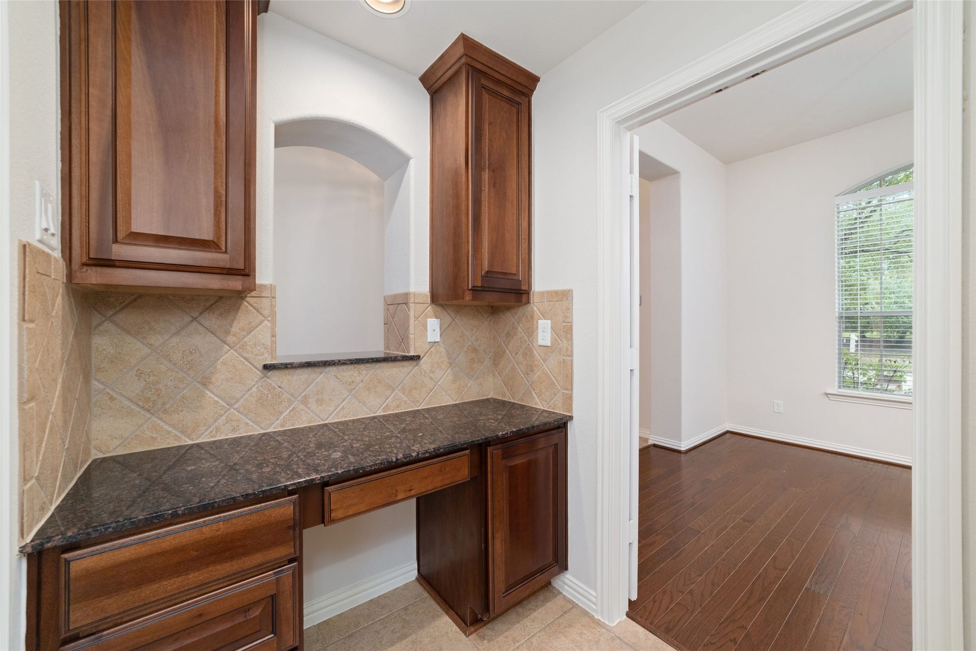 Butlers pantry separating kitchen and formal dining room